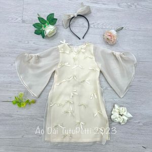 Áo Dài Màu Trắng Dính Nơ Cho Bé Diện Tết